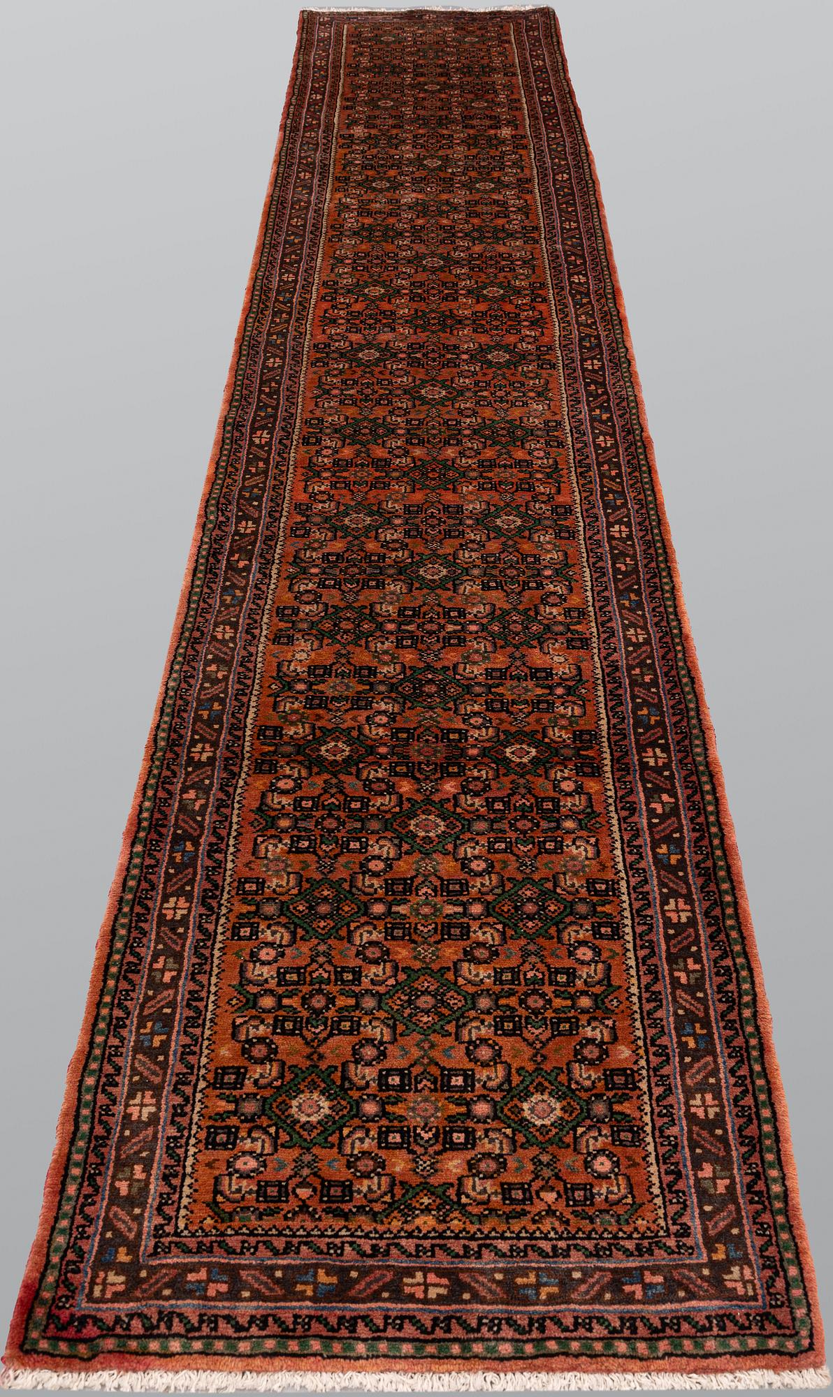 A Hosseinabad runner, approx. 397 x 84 cm.
