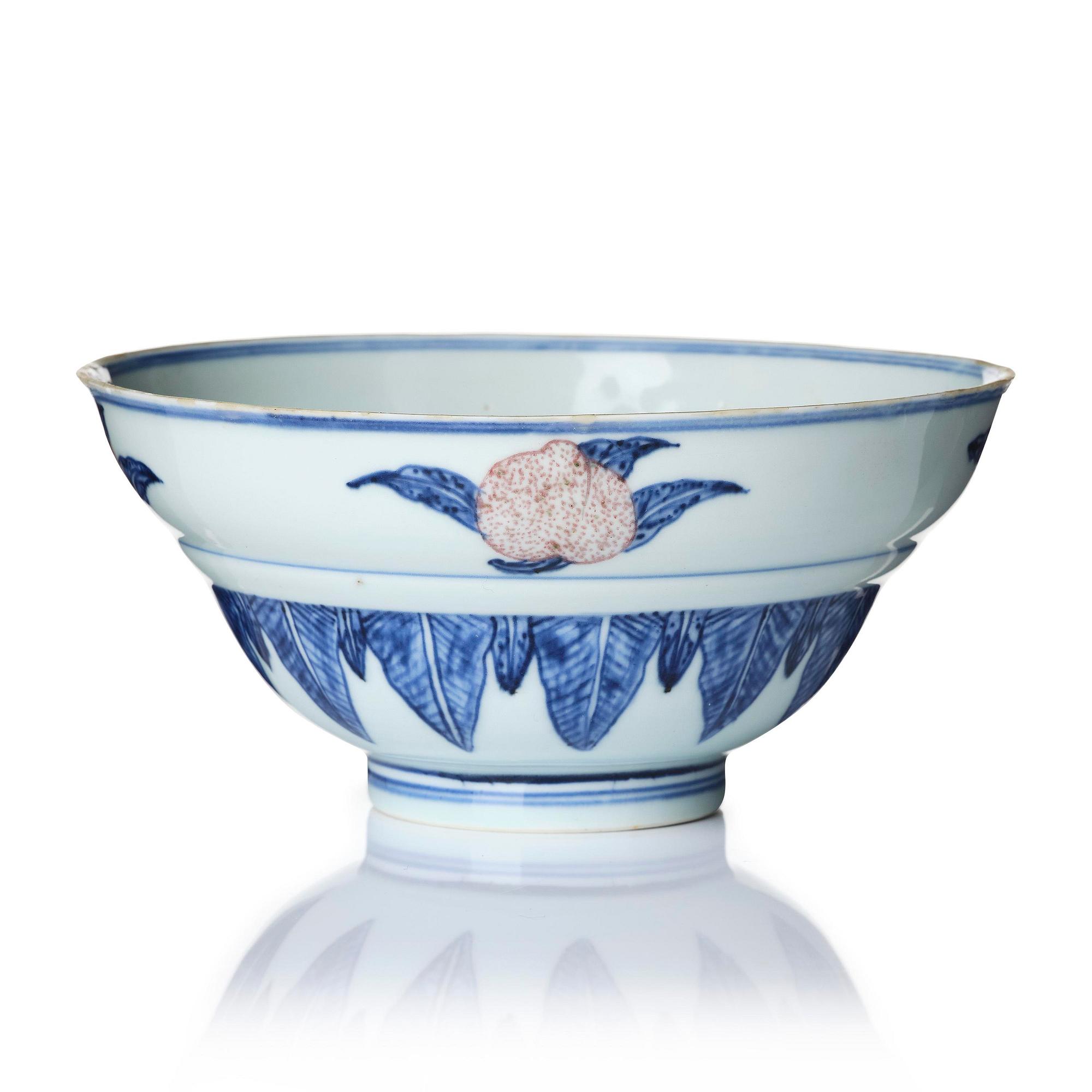 A blue and white and copper-red 'peaches' bowl, Qing dynasty.