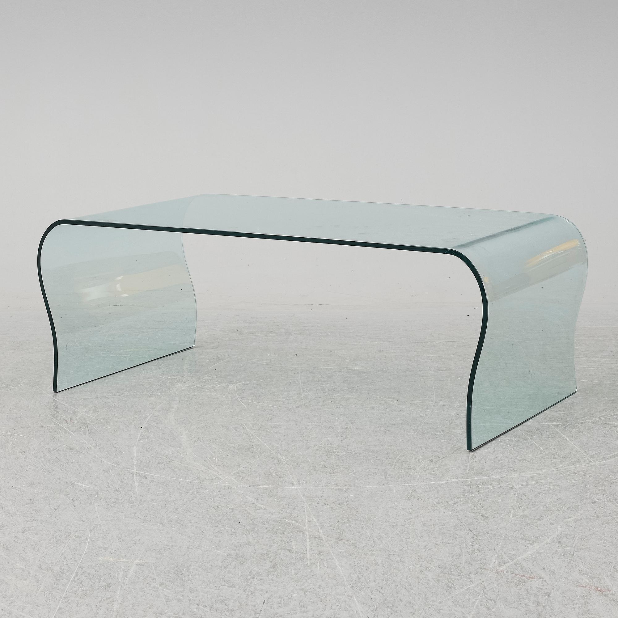 A mid 20th Century glass coffee table.