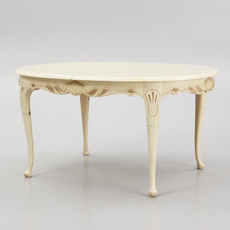 A Rococo style Dining Table with Chairs, first half of the 20th Century.