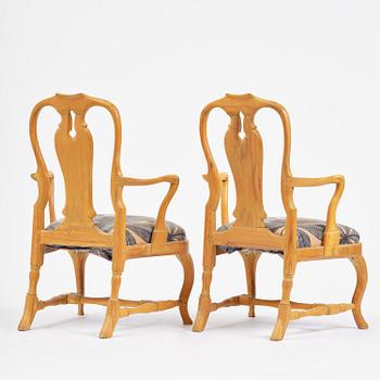 A pair of rococo open-back armchairs, Stockholm, later part 18th century.