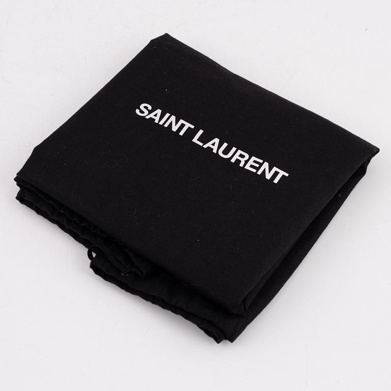 Yves Saint Laurent, a burgundy leather and suede handbag.
