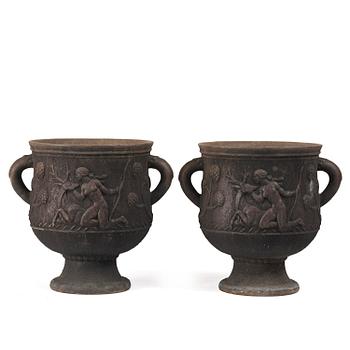 356. Ivar Johnsson, a pair of "Diana" cast iron urns, Näfveqvarns bruk, Swedish Grace.