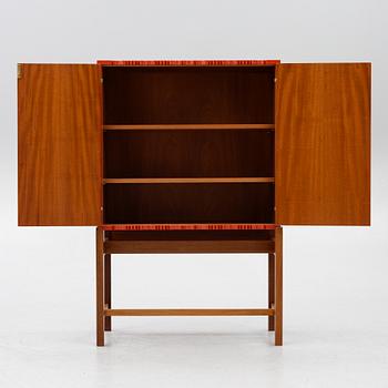 Josef Frank, a red lacquered cabinet, model 2192, 'The Cardboard Cabinet' by Svenskt Tenn, after 1985.