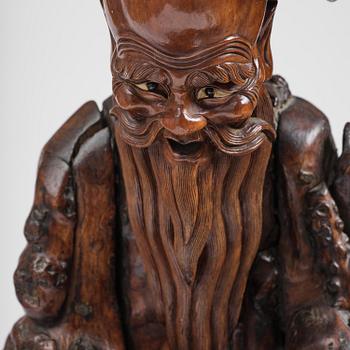 A large well sculptured root sculpture of 'Sholau and attendant', late Qing dynasty, 19th century.