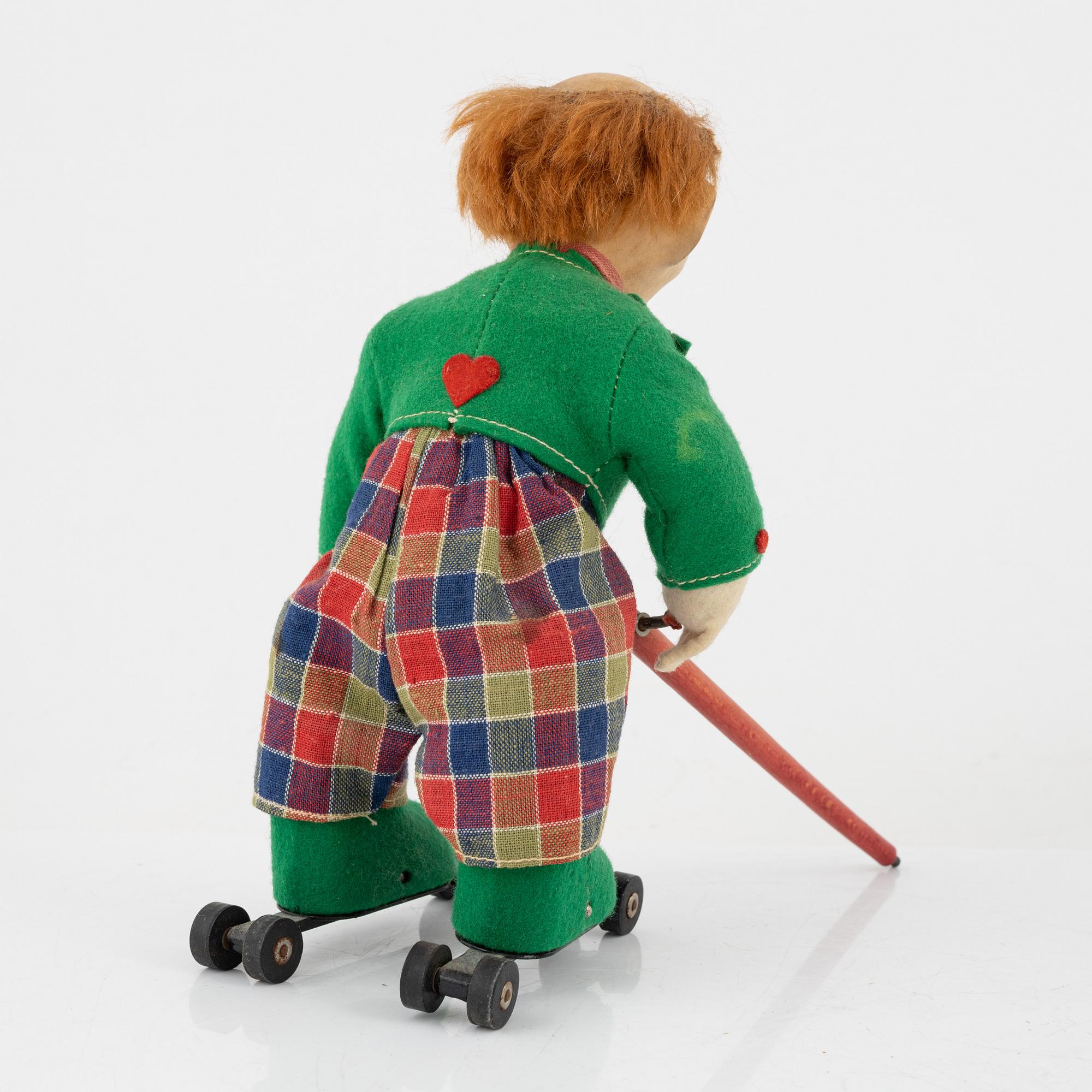 A set of five toys, including 'Rolly' clown from Schuco, 20th century.