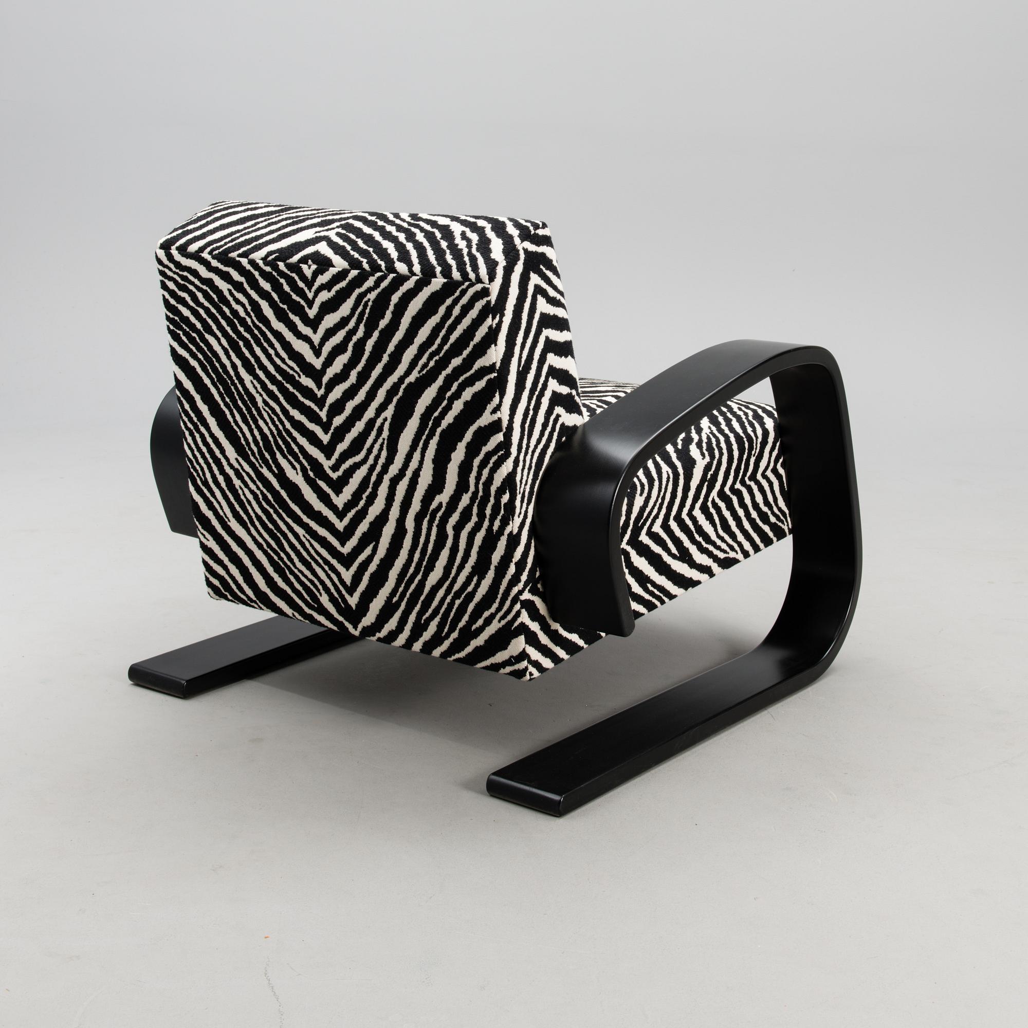 An armchair no 400, designed in 1936.