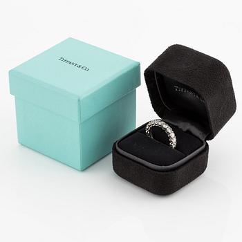 A platinum Tiffany & Co eternity ring set with round brilliant-cut diamonds.