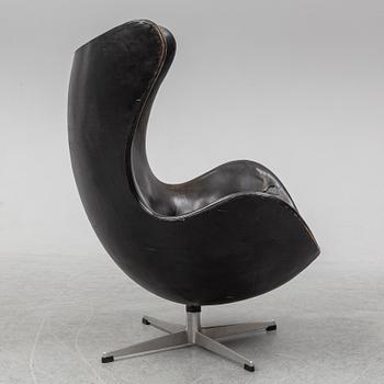 ARNE JACOBSEN, an 'Egg' leather covered easy chair and ottoman, Fritz Hansen, Denmark.