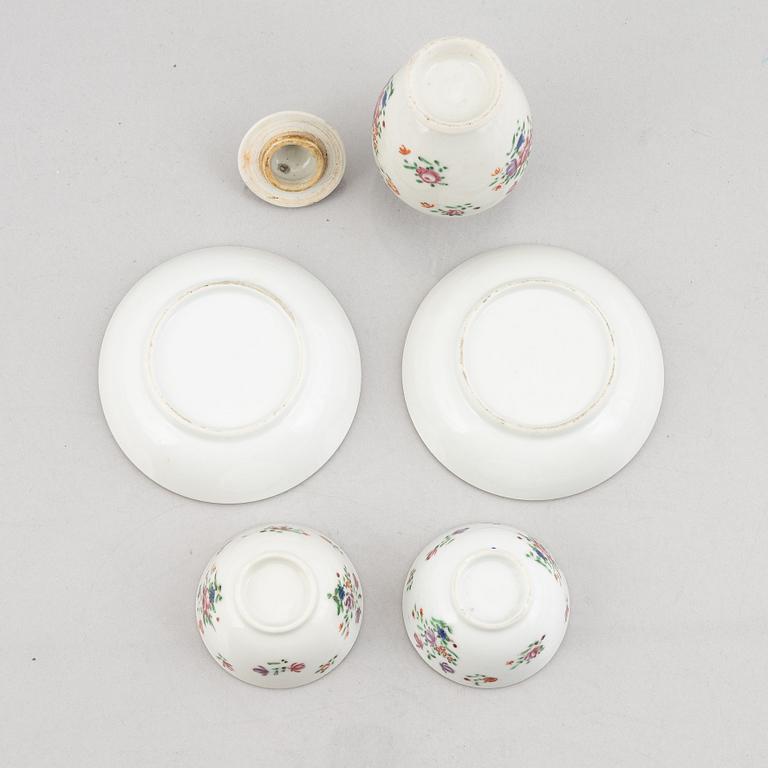 A pair of export porcelain Famille Rose cups with saucers, a small baluster urn with cover, China, Qianlong (1736-95).