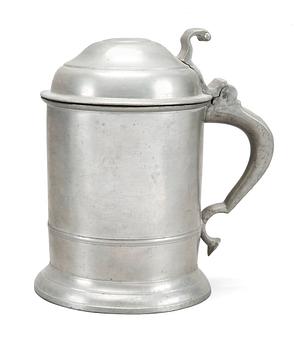 64. A PEWTER TANKARD,