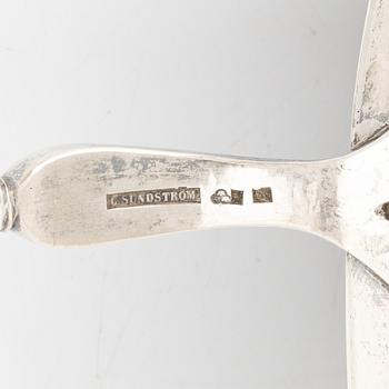 A silver mounted soup ladle with a coconut cup.