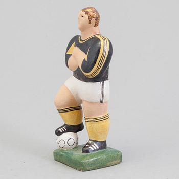 A Lisa Larson figure of a football player, Sweden.