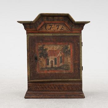 A hanging cabinet, Dalarna, dated 1776.