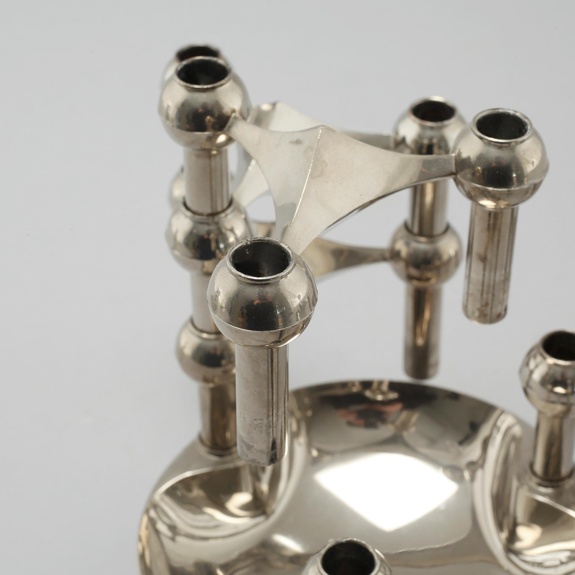 A metal candlestick with eleven parts by Ceasar Stoffi and Fritz Nagel, second half of the 20th century.