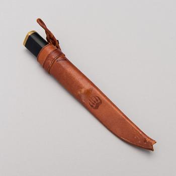 TAPIO WIRKKALA, PUUKKO-KNIV, rostfritt stål, nylon och mässing, Hackman Finland. Modellen formgiven 1961.