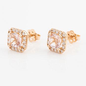 A pair of 18K gold earrings with faceted morganites and round brilliant-cut diamonds.