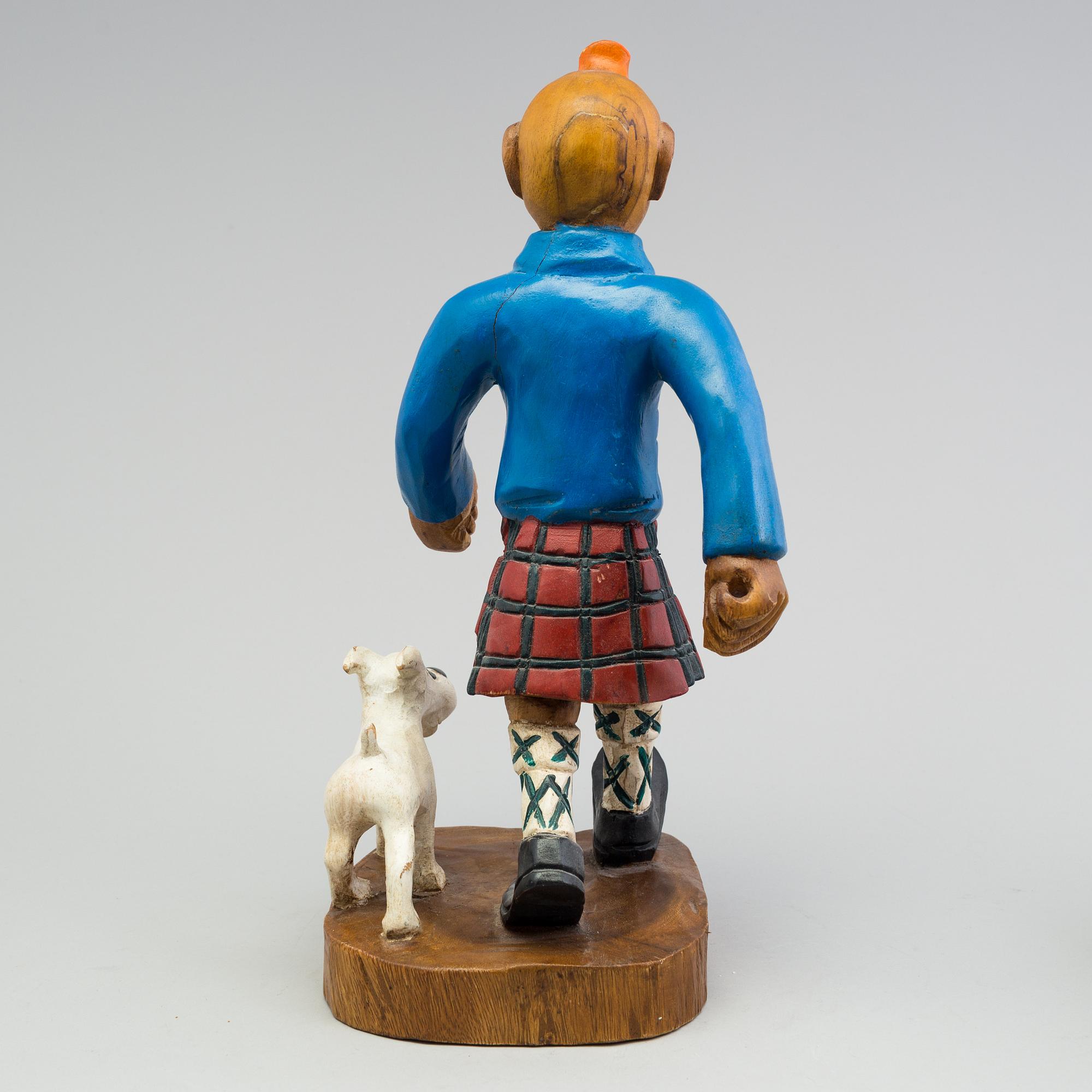 a Tintin and snowy wood scuplture from the second half of the 20th century.