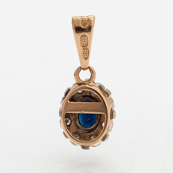 A set of 14K gold ring and pendant with diamonds ca. 0.05 ct in total and sapphires.