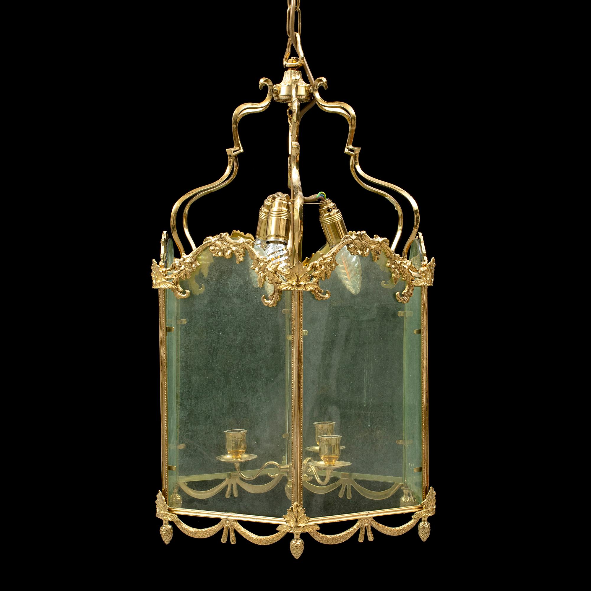 A brass ceiling light "Jubileumslyktan" by K.A. Jonsson, signed and dated 2002.