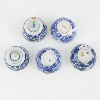 A group of thirteen cups, a bowl and a cup holder, four saucers, partly China and 18th century,