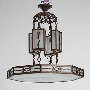 Carl Westman, attributed to, a wrought iron and frosted glass Art Nouveau chandelier, Sweden ca 1915.