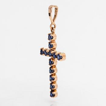 A 14K gold cross pendant with sapphires. Russia, 21st-century.