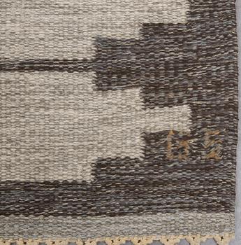 A signed flat weave carpet 220x160 cm.