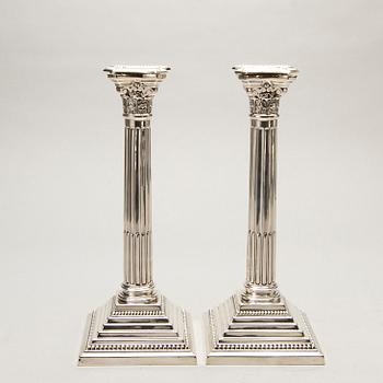 A pair of classical column sterling silver candlesticks Birmingham, 1934, by 'B.G. & Co'.