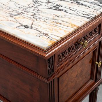 A pair of eclectic 20th century bedside tables.