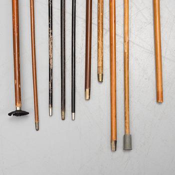 NINE WALKING STICKS, silver handles and a stick with plate handle, first half of the 20th century.