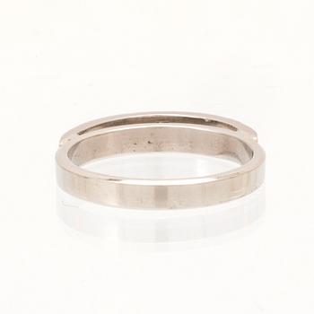 An 18K white gold ring set with round single cut dimamonds.