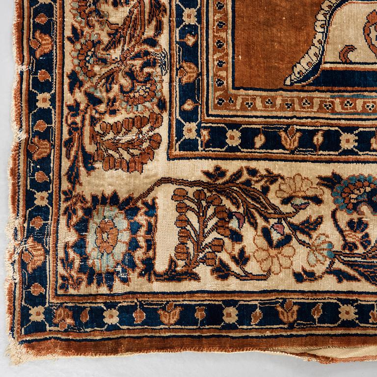 A RUG. An antique silk Heriz. 177 x 146 cm.