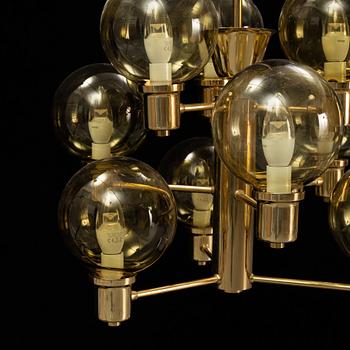 A 1960's brass and glass ceiling light.