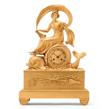 1288. A French late Empire 1820's gilt bronze mantel clock marked "TROGNON À BORDEAUX".