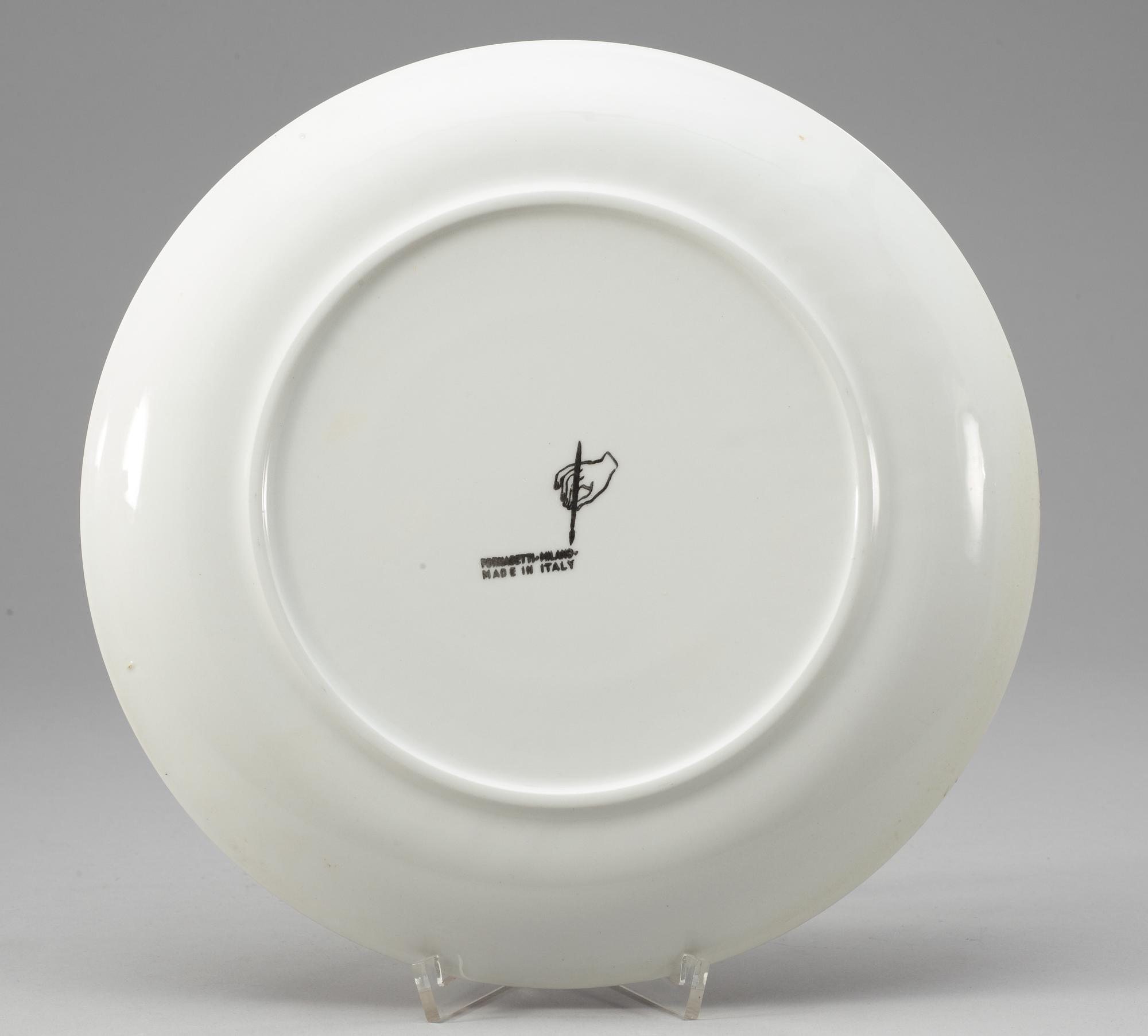 A set of nine Piero Fornasetti 'Sun and Moon' plates, Milano, Italy.