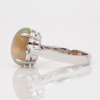 An opal and brilliant-cut diamond ring.