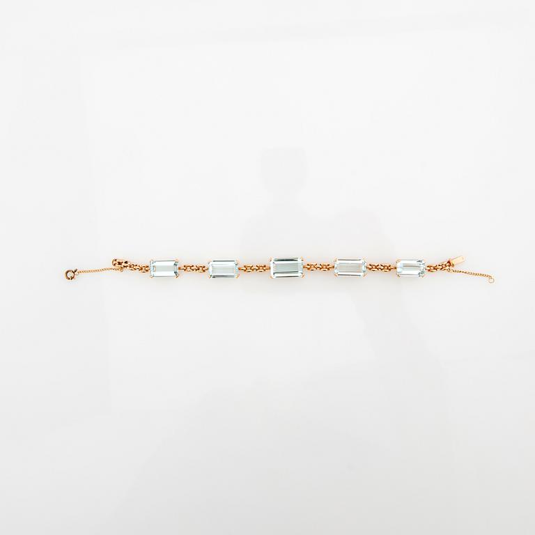 Bracelet 18K gold with step-cut aquamarines.