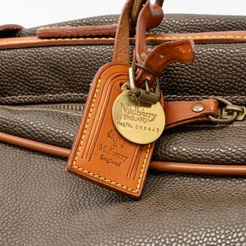 Mulberry, a scotch grain suitcase.