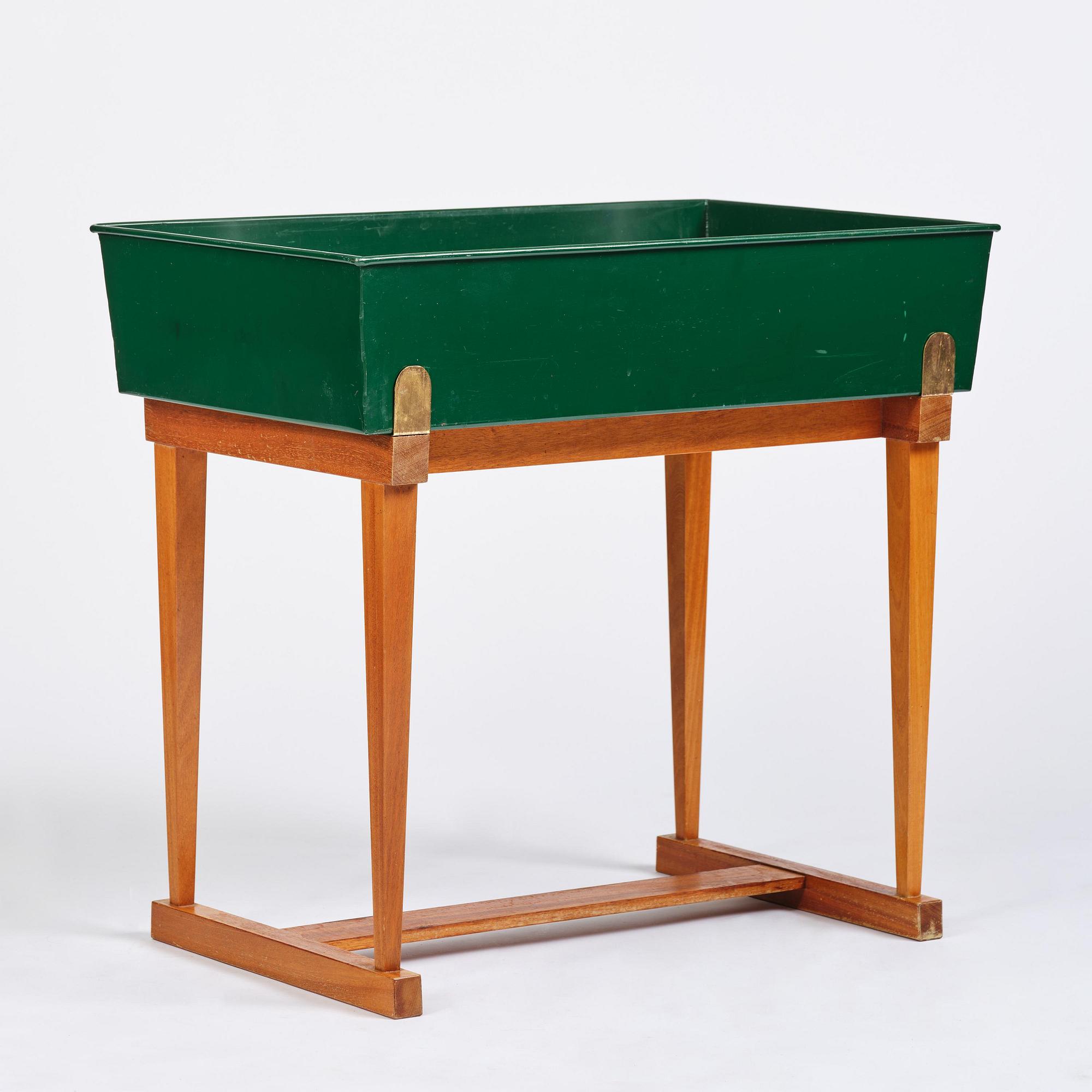 Josef Frank, a rare flower table with green lacquered box model B 2084, Firma Svenskt Tenn, 1950-60s.