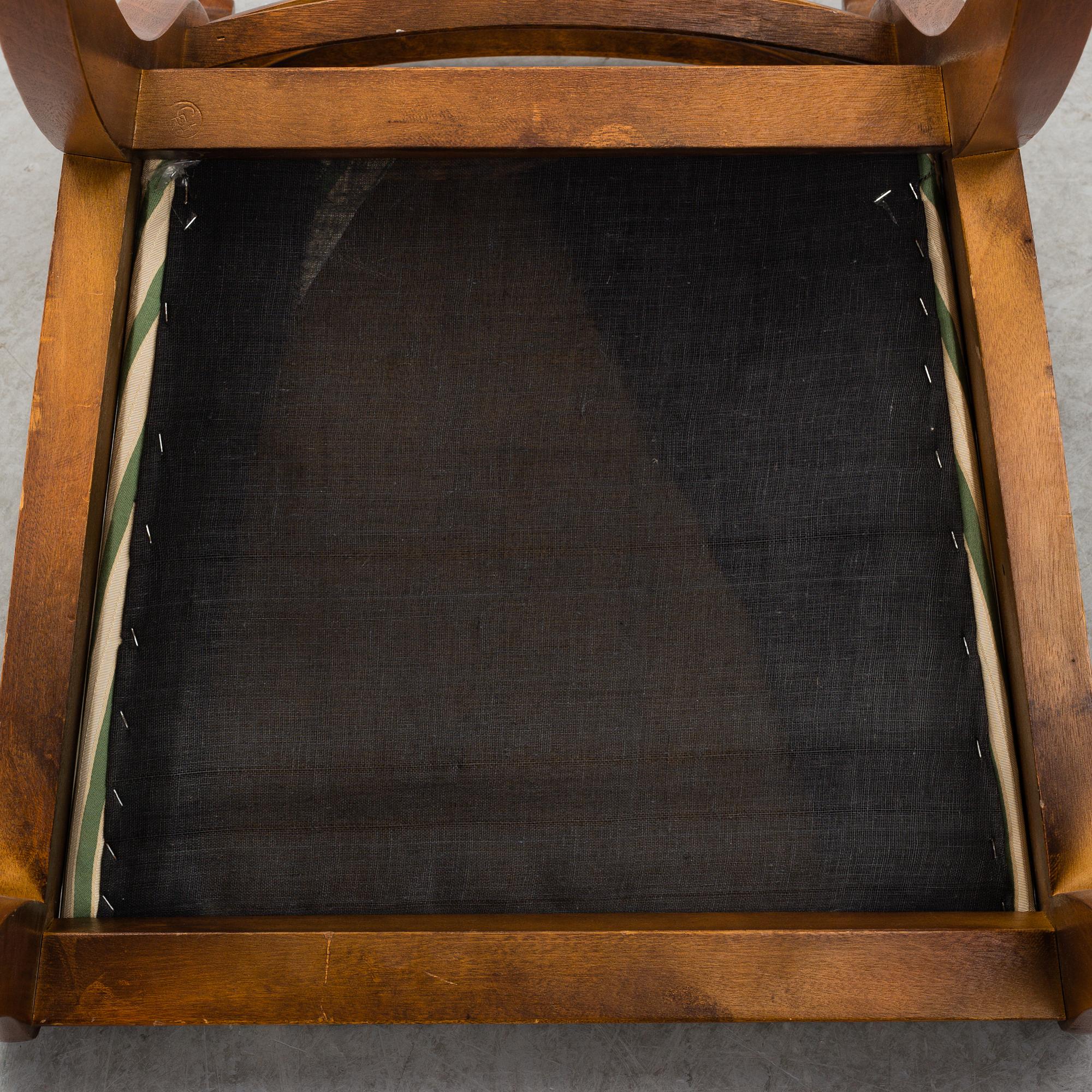 A late 20th century English style dining table and six chairs.