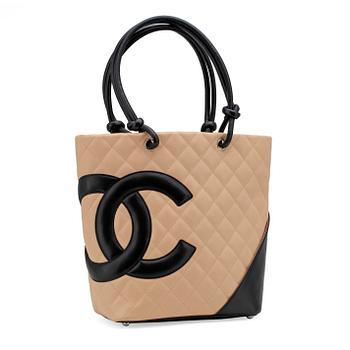 CHANEL, a beige leather "Large Shopping" handbag.