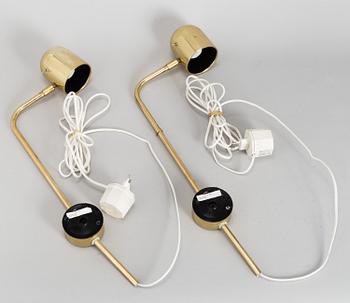 A pair of brass wall lights by Bergboms.