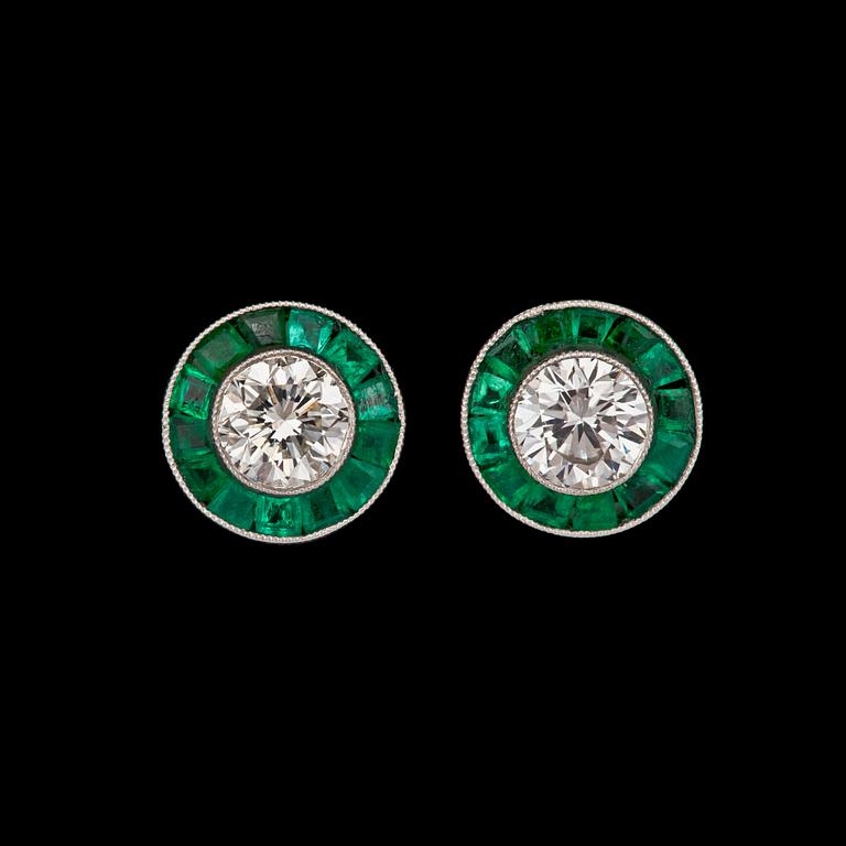 A pair of tapered bagutte and brilliant cut diamond earrings.