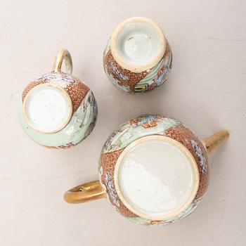 A Chinese Qianlong porcelain teapot, creamer and tea caddy.