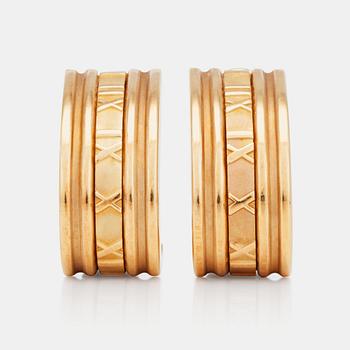 A pair of Tiffany & co gold earrings.