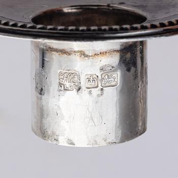 Four early 20th century silver candlesticks, marks of Hawksworth, Eyre & Co Ltd, Sheffield, England 1904-1906.