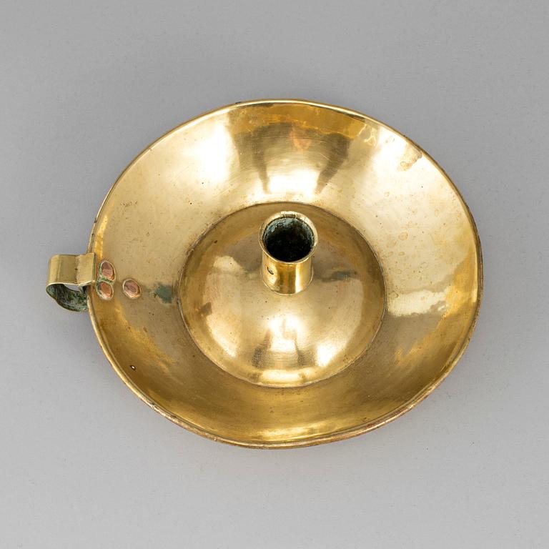 An 18th century brass night light.