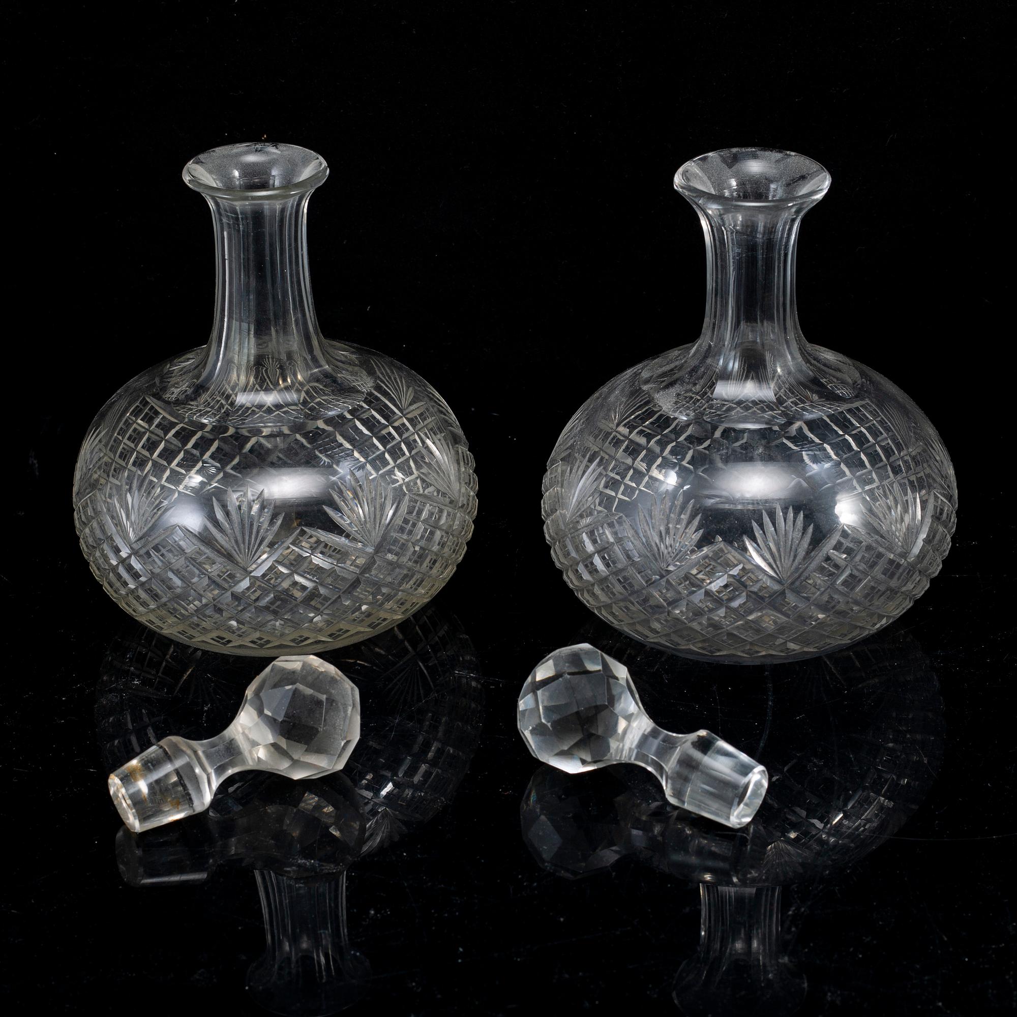 A set of four bottles with stoppers, 20th Century.
