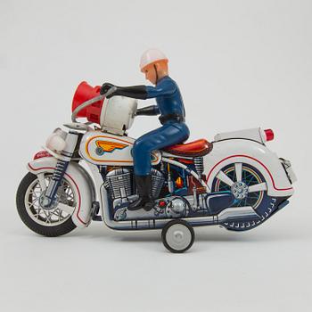 A Yoshiya robot and a Masudaya police motorcycle, Japan, 1960s.